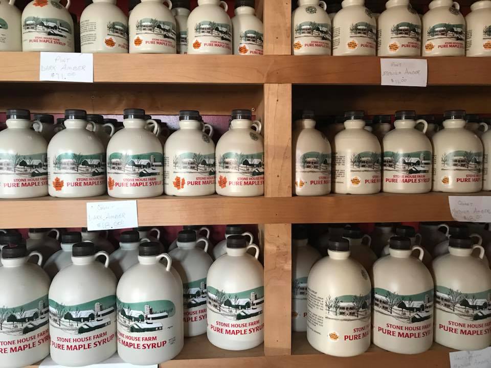 jugs of maple syrup on our syrup racks